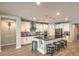 Modern kitchen features granite countertops, stainless steel appliances, and a breakfast bar at 8257 Skye Peak St, Las Vegas, NV 89166