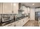 Close up of modern kitchen features granite countertops and stainless steel appliances at 8257 Skye Peak St, Las Vegas, NV 89166