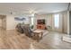 Spacious living room with tile floors, a ceiling fan, and large windows provides ample natural light at 8257 Skye Peak St, Las Vegas, NV 89166