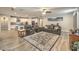 Inviting living room features an open layout, tile floors, and modern kitchen access at 8257 Skye Peak St, Las Vegas, NV 89166