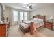 Comfortable main bedroom features plush carpet, ample natural light, and an ensuite bathroom at 8257 Skye Peak St, Las Vegas, NV 89166