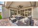 Inviting covered patio with comfortable seating and stylish outdoor furniture and a ceiling fan at 8257 Skye Peak St, Las Vegas, NV 89166