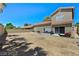 House exterior with patio, outdoor furniture, and a spacious dirt backyard at 8355 Cabin Peak St, Las Vegas, NV 89123