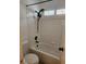 Clean bathroom with a white tiled shower and bathtub combo at 8355 Cabin Peak St, Las Vegas, NV 89123