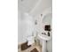 Bright powder room featuring a pedestal sink, framed mirror, and decorative accents at 8355 Cabin Peak St, Las Vegas, NV 89123