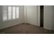 Bedroom with carpet, closet with sliding doors and natural light from the shuttered window at 8355 Cabin Peak St, Las Vegas, NV 89123