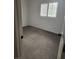 Bedroom with neutral carpet and a window with shutters at 8355 Cabin Peak St, Las Vegas, NV 89123
