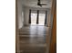 Bedroom with wood-look flooring and sliding glass door to the backyard at 8355 Cabin Peak St, Las Vegas, NV 89123