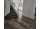 Open entryway featuring a staircase, wood floors, and ample natural light at 8355 Cabin Peak St, Las Vegas, NV 89123