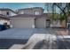 Charming two-story home featuring a three-car garage and a well-maintained front yard at 8355 Cabin Peak St, Las Vegas, NV 89123