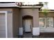 Inviting front entrance showcasing an arched entryway, shutters, and decorative exterior details at 8355 Cabin Peak St, Las Vegas, NV 89123