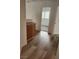 Hallway featuring wood-look flooring leading to sunlit rooms at 8355 Cabin Peak St, Las Vegas, NV 89123