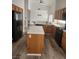 Bright kitchen featuring stainless steel appliances, tile countertops, and wood cabinets at 8355 Cabin Peak St, Las Vegas, NV 89123