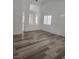 Bright living space with wood floors, white walls, and plantation shutters at 8355 Cabin Peak St, Las Vegas, NV 89123