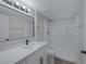 Bathroom featuring bright lights, quartz countertop, and a shower and tub combination at 8410 Eldora Ave # 1045, Las Vegas, NV 89117