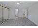 Bright bedroom featuring plush carpet, neutral walls, and a mirrored closet at 8410 Eldora Ave # 1045, Las Vegas, NV 89117
