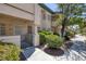 Inviting condo with a gated front patio area with mature plants and trees at 8410 Eldora Ave # 1045, Las Vegas, NV 89117