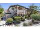 A charming two-story condo complex with lush landscaping and inviting stairways at 8410 Eldora Ave # 1045, Las Vegas, NV 89117