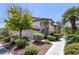 Beautiful condo complex with mature trees, manicured landscaping, and walkway at 8410 Eldora Ave # 1045, Las Vegas, NV 89117