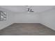 Living room features wood-look floors, ceiling fan, and large windows at 8410 Eldora Ave # 1045, Las Vegas, NV 89117