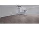 Bright living space flows into a modern kitchen area, showcasing new flooring and appliances at 8410 Eldora Ave # 1045, Las Vegas, NV 89117