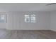 Spacious living room featuring modern flooring and natural light through updated windows at 8410 Eldora Ave # 1045, Las Vegas, NV 89117