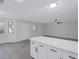 Bright and airy living room with wood-look floors and stylish island at 8410 Eldora Ave # 1045, Las Vegas, NV 89117