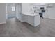 Bright, modern kitchen seamlessly integrates with the living area with sleek countertops at 8410 Eldora Ave # 1045, Las Vegas, NV 89117