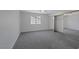 Spacious bedroom with soft carpet, large windows, and mirrored closet doors at 8410 Eldora Ave # 1045, Las Vegas, NV 89117