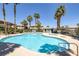 Community pool with ample deck space, lounge chairs, and a spa at 8410 Eldora Ave # 1045, Las Vegas, NV 89117