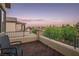 Outdoor balcony with wooden tile floors and stunning views of the landscape at 8647 Tortoise Canyon Ct, Las Vegas, NV 89148