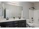 Bright bathroom with dual sinks, modern vanity and walk in shower offers convenience and style at 8647 Tortoise Canyon Ct, Las Vegas, NV 89148