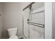 Updated bathroom with glass enclosed shower, brushed nickel hardware and toilet at 8647 Tortoise Canyon Ct, Las Vegas, NV 89148