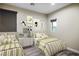 A shared bedroom with two twin beds and playful animal themed art for a fun, whimsical space at 8647 Tortoise Canyon Ct, Las Vegas, NV 89148