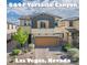 Charming two-story home featuring a two-car garage, neutral paint, and well manicured landscaping in Las Vegas, Nevada at 8647 Tortoise Canyon Ct, Las Vegas, NV 89148