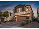Charming two story home with a two car garage, neutral paint, rock accents and manicured landscaping in Las Vegas, Nevada at 8647 Tortoise Canyon Ct, Las Vegas, NV 89148