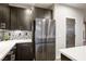Well-lit kitchen with stainless refrigerator and decorative backsplash at 8647 Tortoise Canyon Ct, Las Vegas, NV 89148