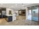 Open floor plan with a view from the kitchen to the living room and outdoor access at 8647 Tortoise Canyon Ct, Las Vegas, NV 89148
