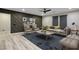 Stylish living room with a textured accent wall, modern decor, and ample seating at 8647 Tortoise Canyon Ct, Las Vegas, NV 89148