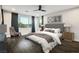 Bright main bedroom with scenic views, plush bedding, and stylish contemporary furnishings at 8647 Tortoise Canyon Ct, Las Vegas, NV 89148