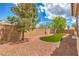 Backyard boasting artificial turf, rock landscaping, and privacy wall at 8664 Frasure Falls Ave, Las Vegas, NV 89178