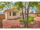 Backyard with turf, rock landscaping, and beautiful home exterior at 8664 Frasure Falls Ave, Las Vegas, NV 89178