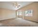 Large bedroom with carpet flooring, vaulted ceiling, and several windows at 8664 Frasure Falls Ave, Las Vegas, NV 89178