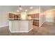 Open kitchen with breakfast bar, wooden cabinets, and recessed lighting at 8664 Frasure Falls Ave, Las Vegas, NV 89178