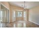Bright, open living room featuring a bay window and sliding glass doors to an outdoor patio at 8664 Frasure Falls Ave, Las Vegas, NV 89178