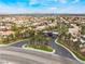 Community featuring tree lined streets and well maintained landscaping with city views in the distance at 8911 Lansberry Ct, Las Vegas, NV 89147