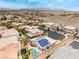 Great view of desert home featuring solar panels, pool, and community at 8911 Lansberry Ct, Las Vegas, NV 89147