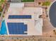 Aerial view of a home with solar panels showcasing its rooftop view and desert landscaping at 8911 Lansberry Ct, Las Vegas, NV 89147