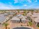 Gorgeous aerial view of a single-story home with a two-car garage, desert landscaping, and solar panels at 8911 Lansberry Ct, Las Vegas, NV 89147
