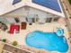 Aerial shot of a backyard showcasing a large pool, spa, and comfortable outdoor seating area at 8911 Lansberry Ct, Las Vegas, NV 89147